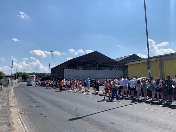 The queue for Motion garden party on Freedom Day