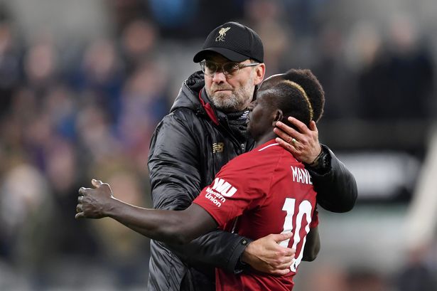 Jurgen Klopp embraces Sadio Mane after the Premier League match between Newcastle United and Liverpool at St James' Park on May 04, 2019