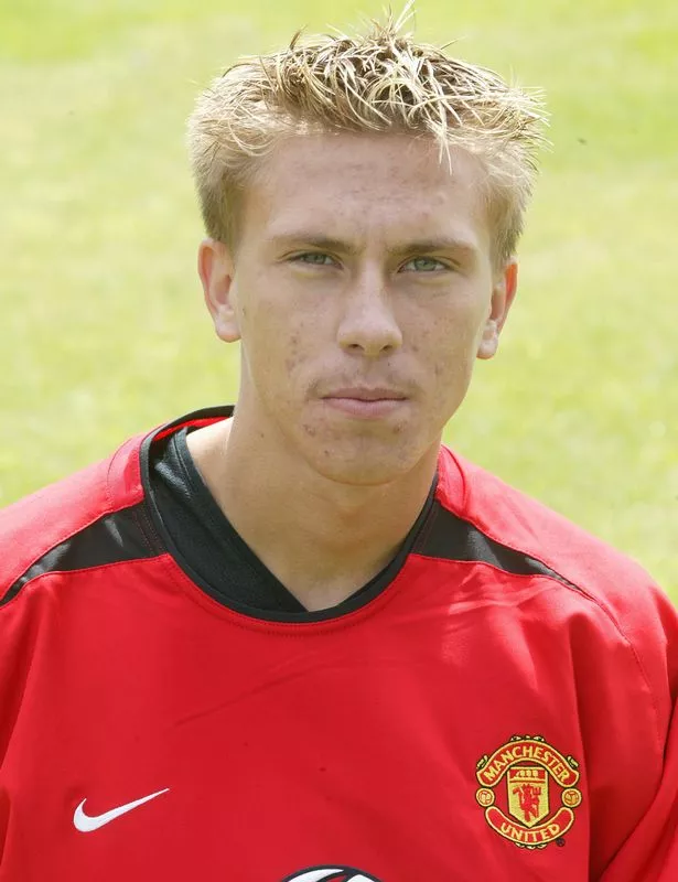 Lee Lawrence poses for an official Manchester United player photo.