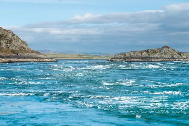 The whirlpool seen in the Gulf of Corryvreckan with rock formations behind it