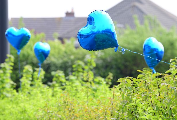 Blue heart shaped balloons in memory of Max Greenhouse in Maghull