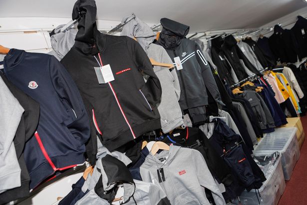 Counterfeit clothes filled the shops from floor to ceiling