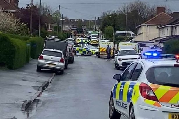 Police pictured at Queenshill Road this afternoon (Friday, April 18).