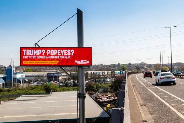 An ad for Miss Millie's fried chicken over the Avonmeads retail park in Bristol where US chain Popeyes opened on Friday, April 11