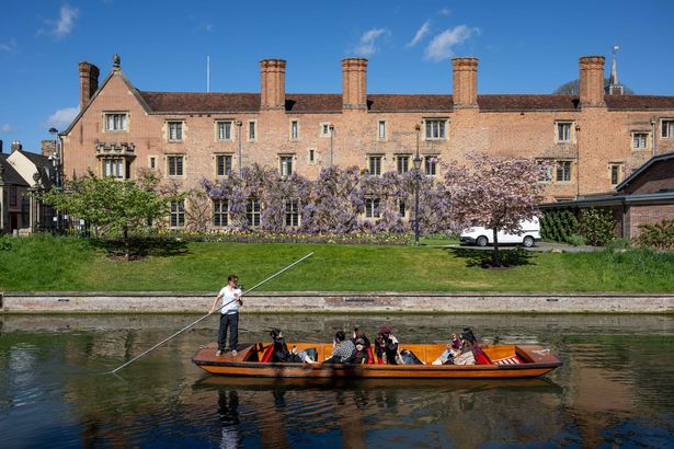 People out punting on the river Cam in Cambridge