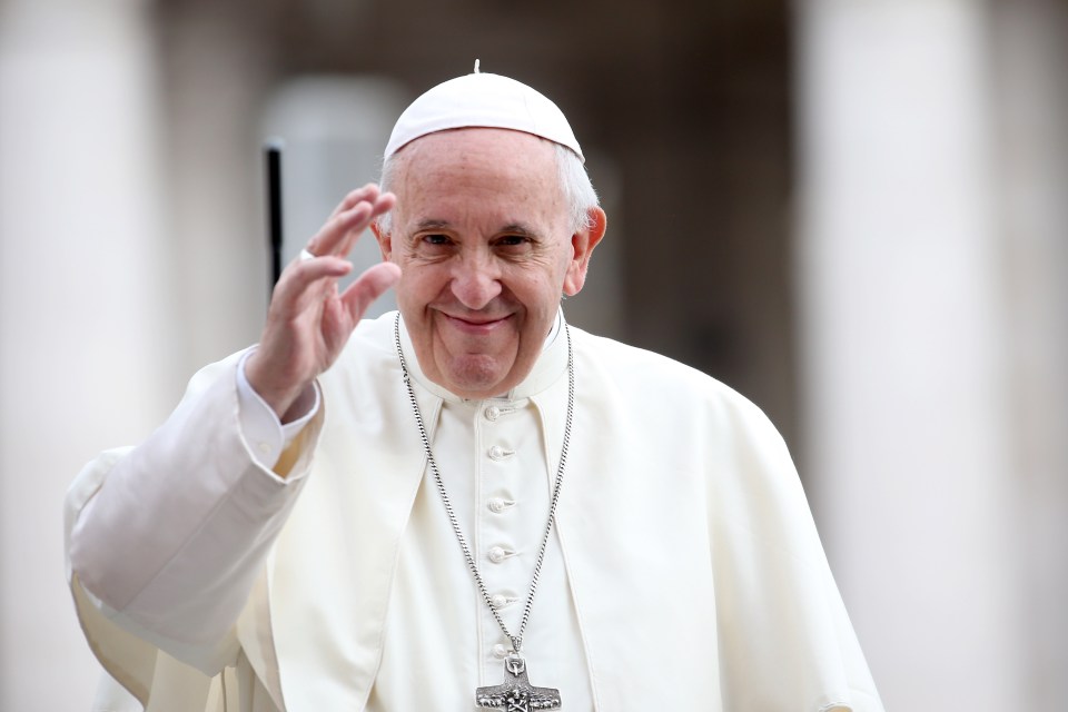 Pope Francis waving to the crowd.