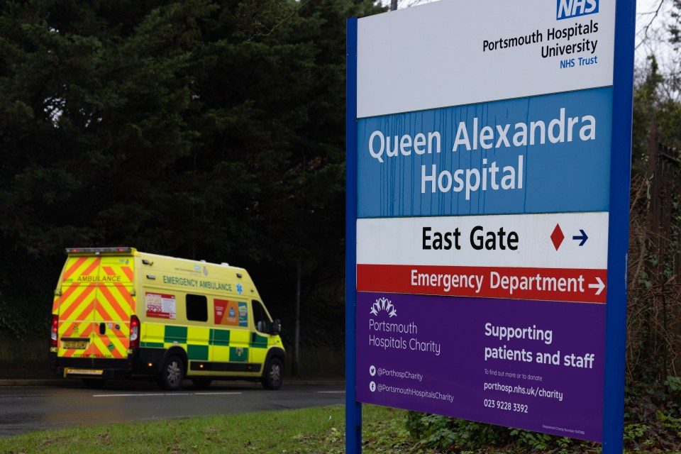Ambulance leaving Queen Alexandra Hospital emergency department.