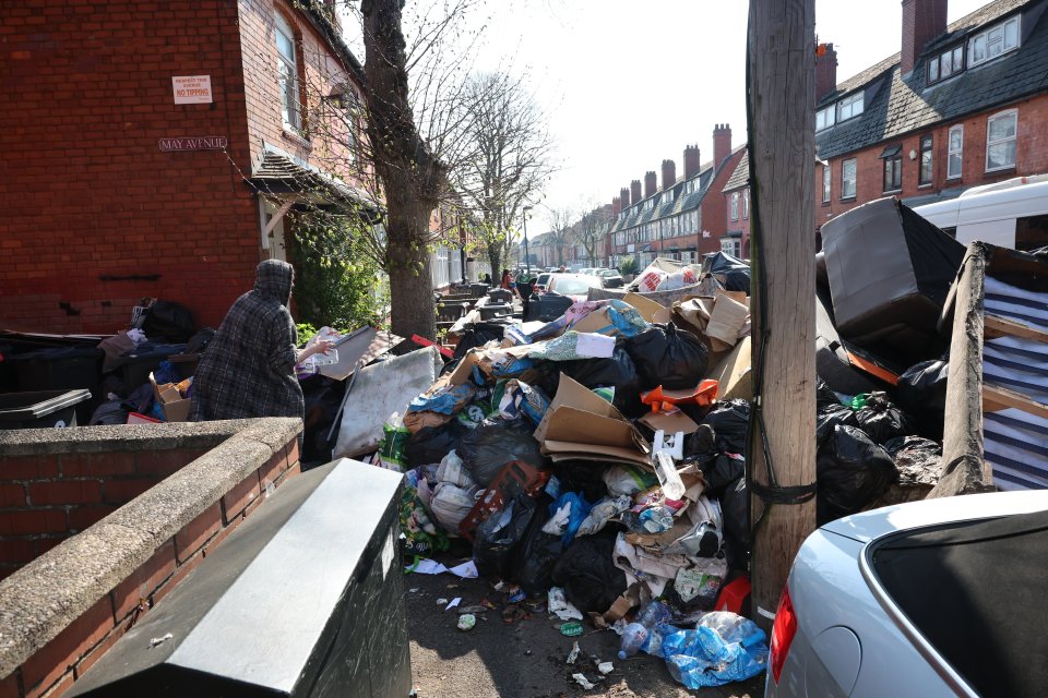 A large pile of rubbish on a residential street, caused by a refuse collectors' strike.
