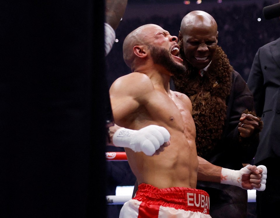 Chris Eubank Jr. celebrates a boxing victory with his father.