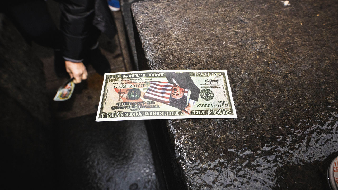 'Trump Dollar' lying on the pavement.
