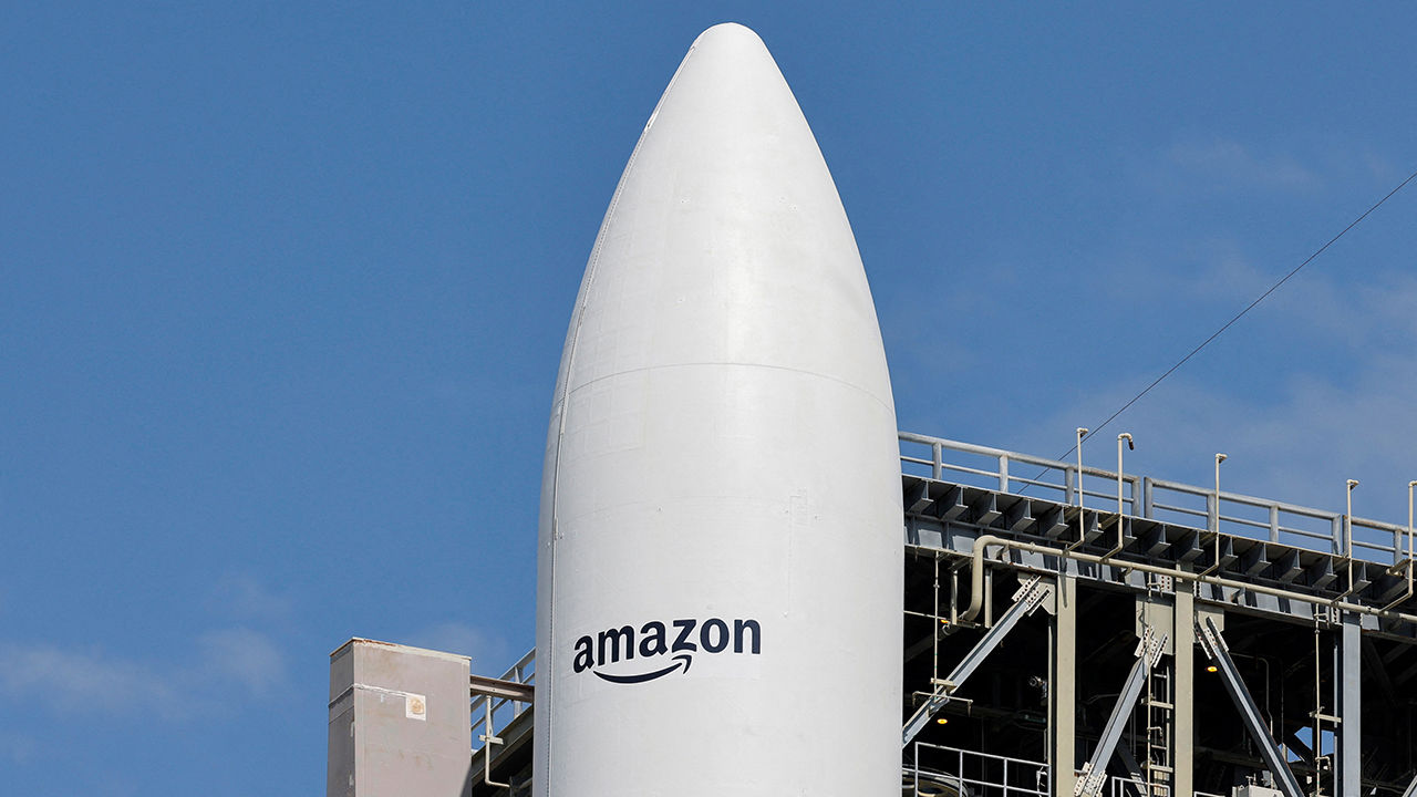 A United Launch Alliance Atlas V rocket is on the launch pad carrying Amazon's Project Kuiper internet network satellite