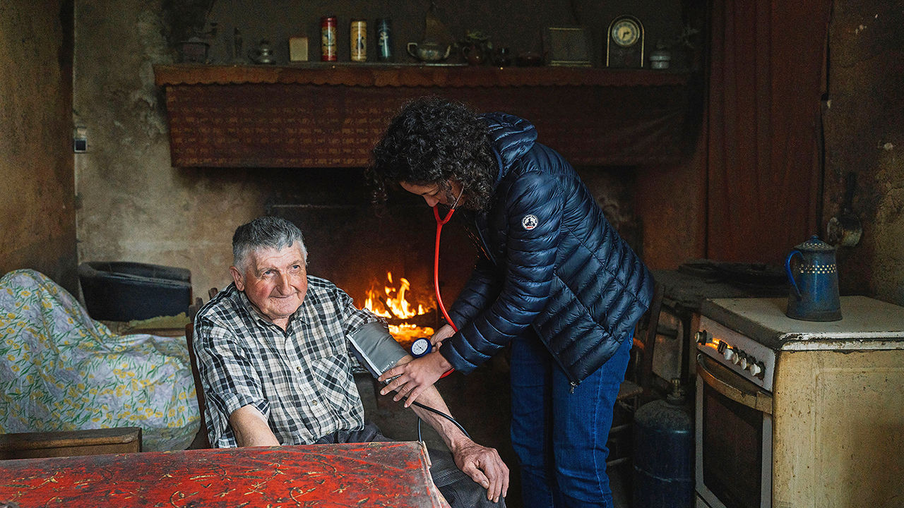 Dr. Godineau, from the Maison de Sante in La Bastide-de-Serou, visits one of his patients, Andre, 75, who has no car and lives in a remote hamlet