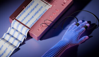 A wire frame hand hooked up to a lie detector. The graph indicates lying