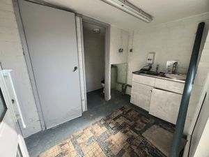 The interior of the tiny former cleaner’s storeroom next to 38 Dingle Lane, Solihull, which is listed for sale with a guide price of just £1