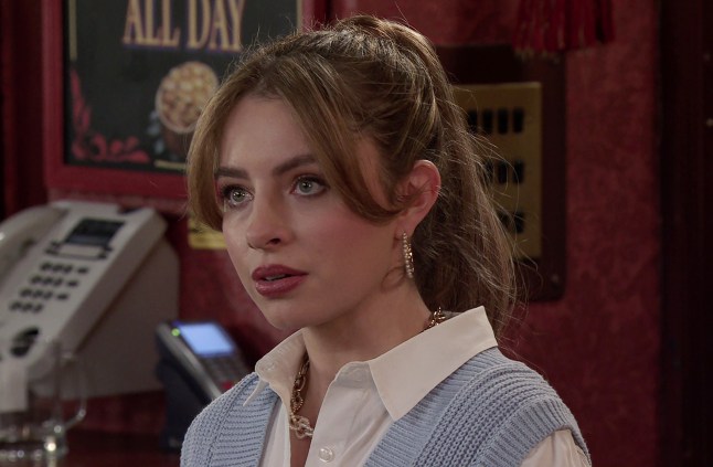 Daisy Midgeley looks stunned behind the bar in Coronation Street