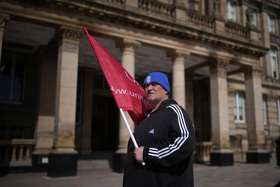 BIRMINGHAM, ENGLAND - APRIL 15: A Unite union member takes part in a rally outside Birmingham Council House as Birmingham council refuse collectors continue their strike on April 15, 2025 in Birmingham, England. On Monday union members voted to reject a council offer to end the refuse workers' strike, as the government announced it had called on office-based military personnel to help the council clear rubbish from Birmingham's streets. Rubbish collectors and members of Unite began intermittent strikes earlier this year over Birmingham City Council's plans to downgrade some staff and reduce their pay, and on March 11 refuse workers declared an indefinite strike after the council's move to use agency staff for bin collections. A major incident has been declared in the city, as uncollected rubbish continues to pile up and case rat infestation. (Photo by Christopher Furlong/Getty Images)