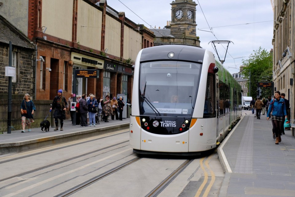 2R6BF8D Edinburgh, Scotland, UK. 8th Jun 2023. The tram extension to Newhaven finally opens to the public this week. The 2.9 mile, eight stop route, which has been under construction since November 2019, has been delivered on schedule and within the ¿207.3m budget. Passengers at the new station at the "Foot of the Walk" on Constitution Street, Leith. Credit: Craig Brown/Alamy Live News