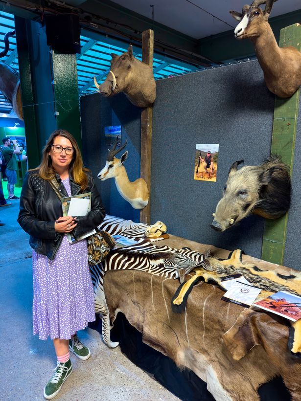 The Mirror's environment editor Nada Farhoud  pictured next to trophies and zebra skins