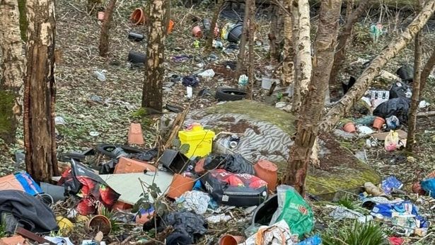 Fly-tipped waste in the Westbrook Gateway area of Bolton close to the River Croal