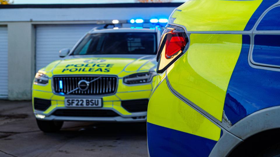 Two Police Scotland vehicles.