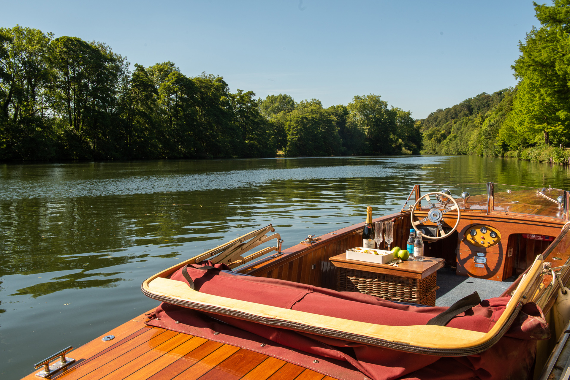A boat on the River Thames in the countryside