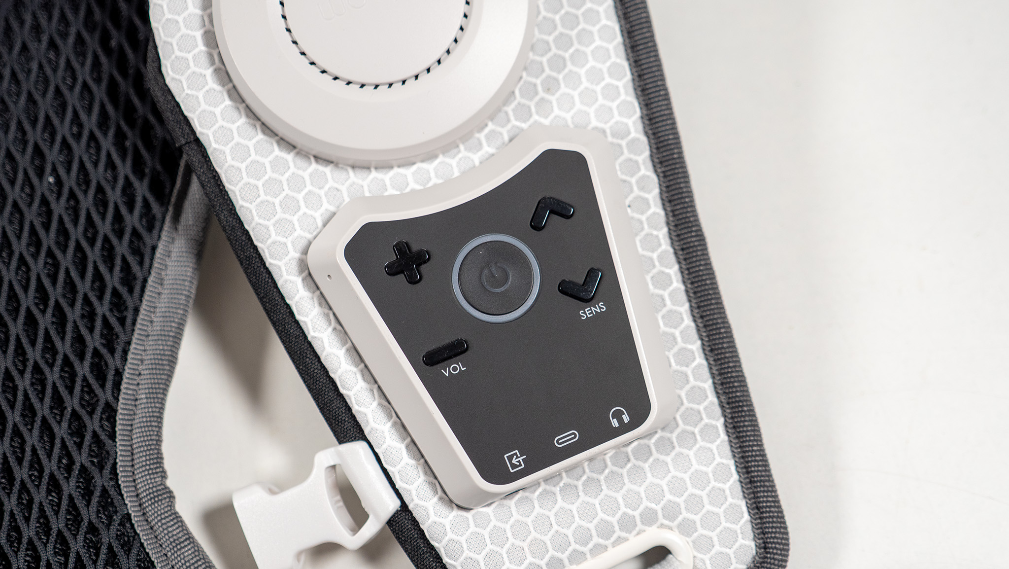 A close-up look at the control panel on the front of the Woojer Haptic Vest 3