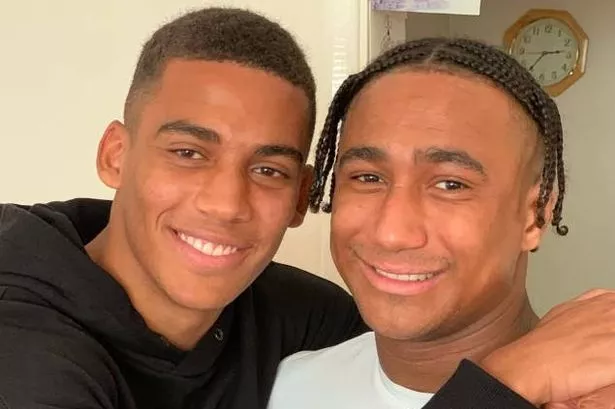 Andy Rinomhota with his brother Joe, who has died at the age of 30