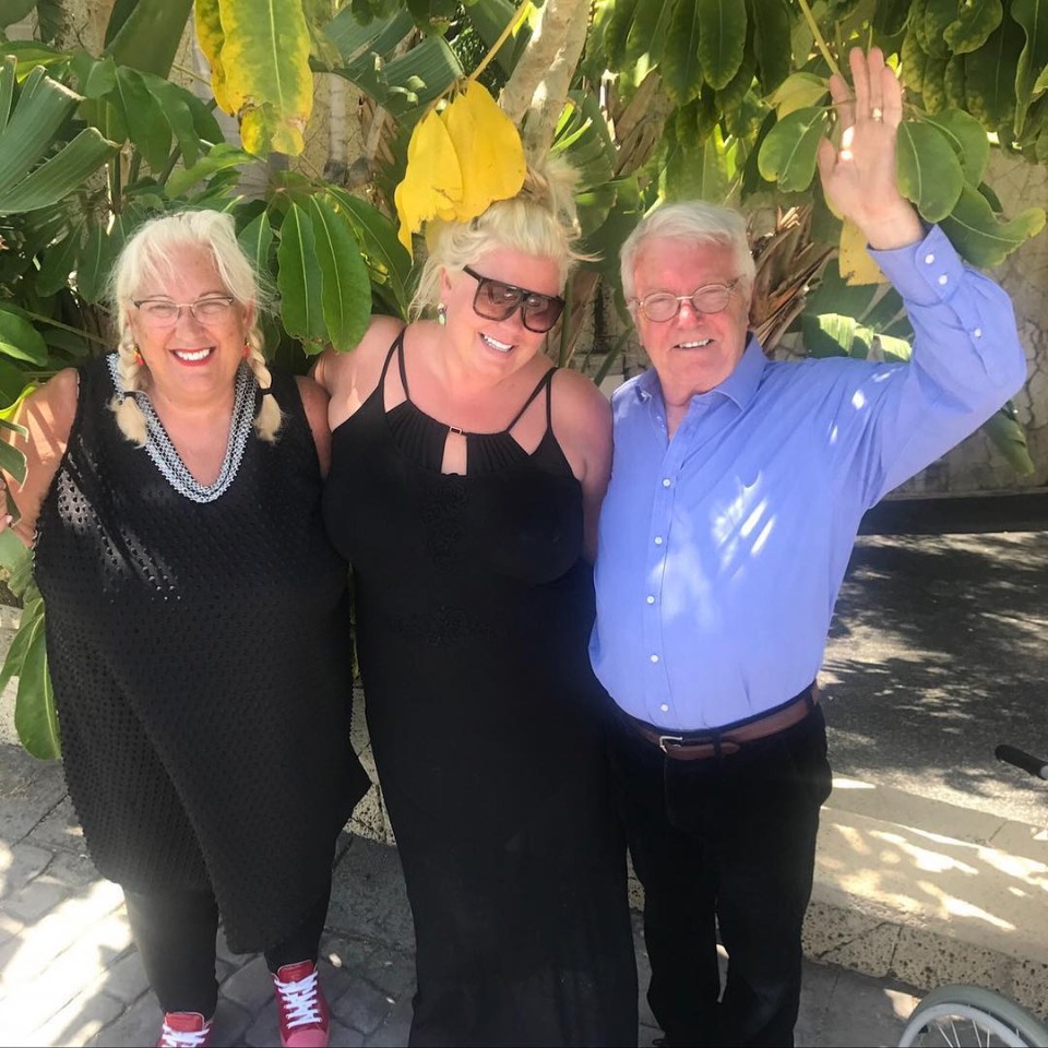 Three people posing for a photo.
