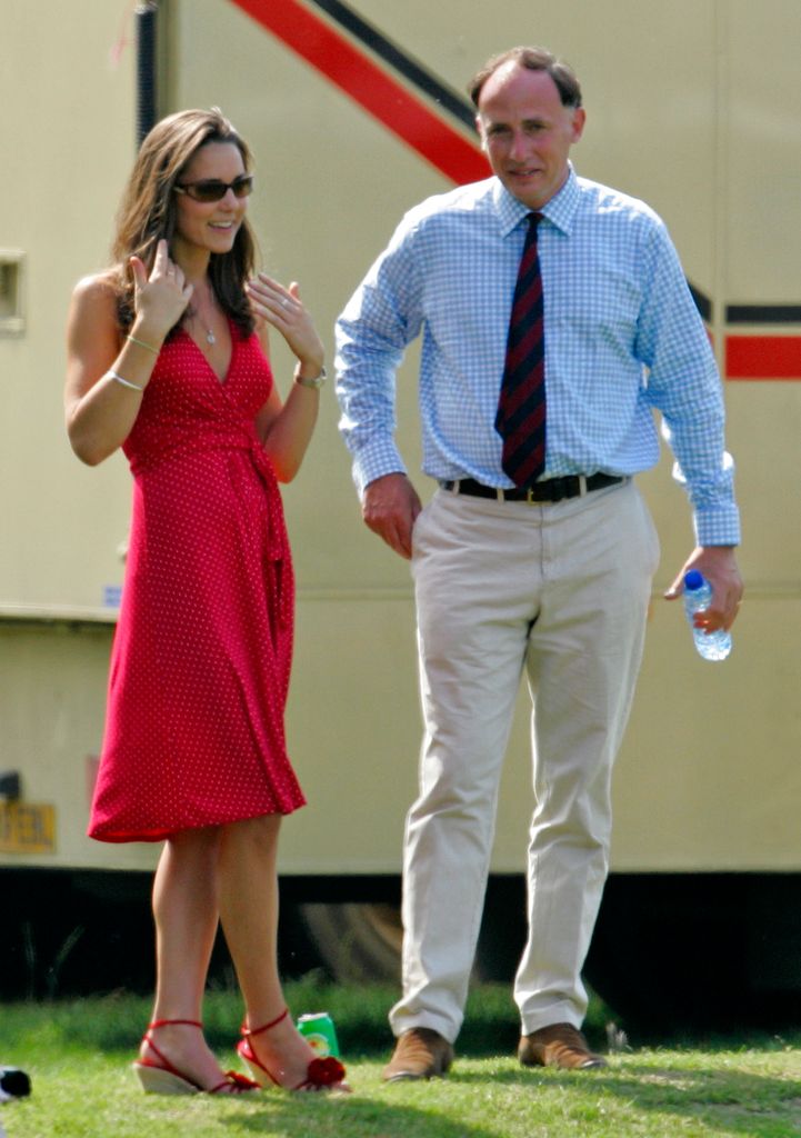 A photo of Kate Middleton wearing a red halterneck dress