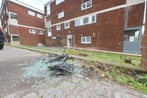 Debris at the scene of the incident iN Bredon Court, Halesowen where three cars were written off and shots fired