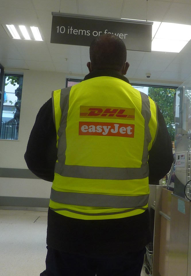 DHL and easyJet employee's back view.