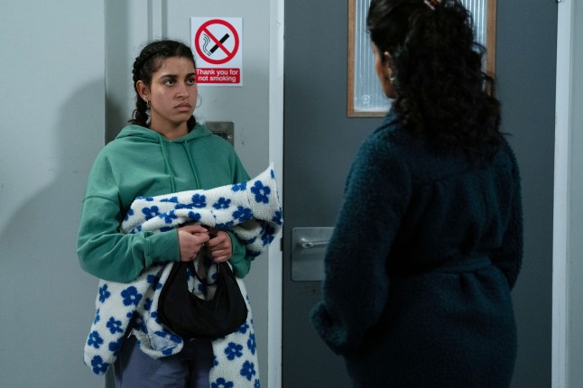 Avani walks out of the police station to speak to Suki in EastEnders