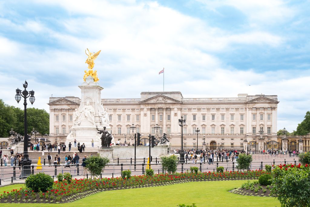 The front of Buckingham Palace on a day with blue skies 