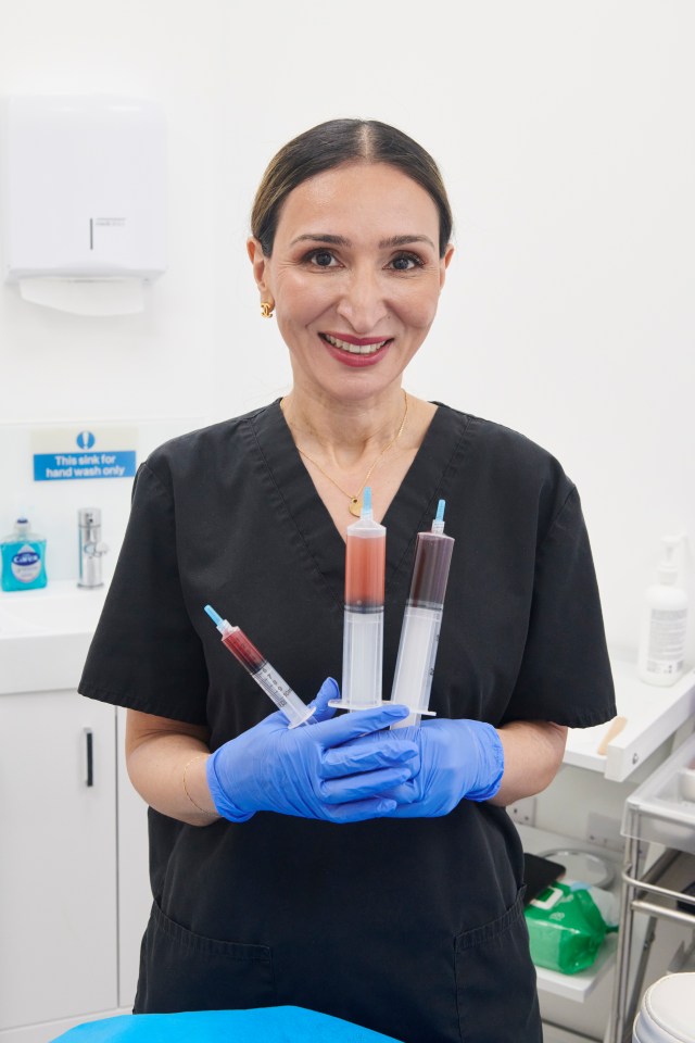 A doctor holding three syringes filled with blood for a vaginal rejuvenation treatment.