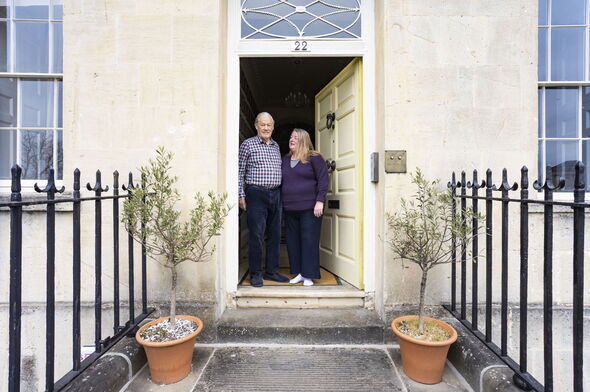 Couple standing in door frame