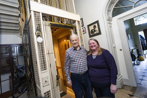 Man and woman standing in doorway 