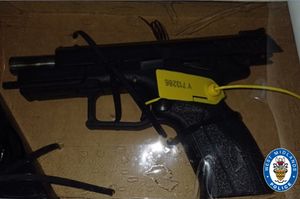 A gun was found during the raid. Photo: West Midlands Police