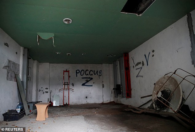 Pictured: A view from a preliminary detention centre which, as Ukrainians say, was used by Russian service members to jail and torture people, before they retreated from Kherson, Ukraine