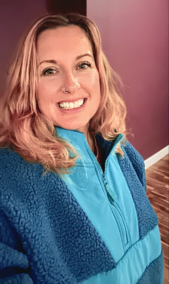 Woman in blue fleece jacket.