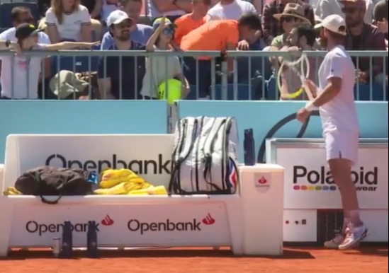 The crowd booed after Moutet pretending to offer his racquet to a young fan