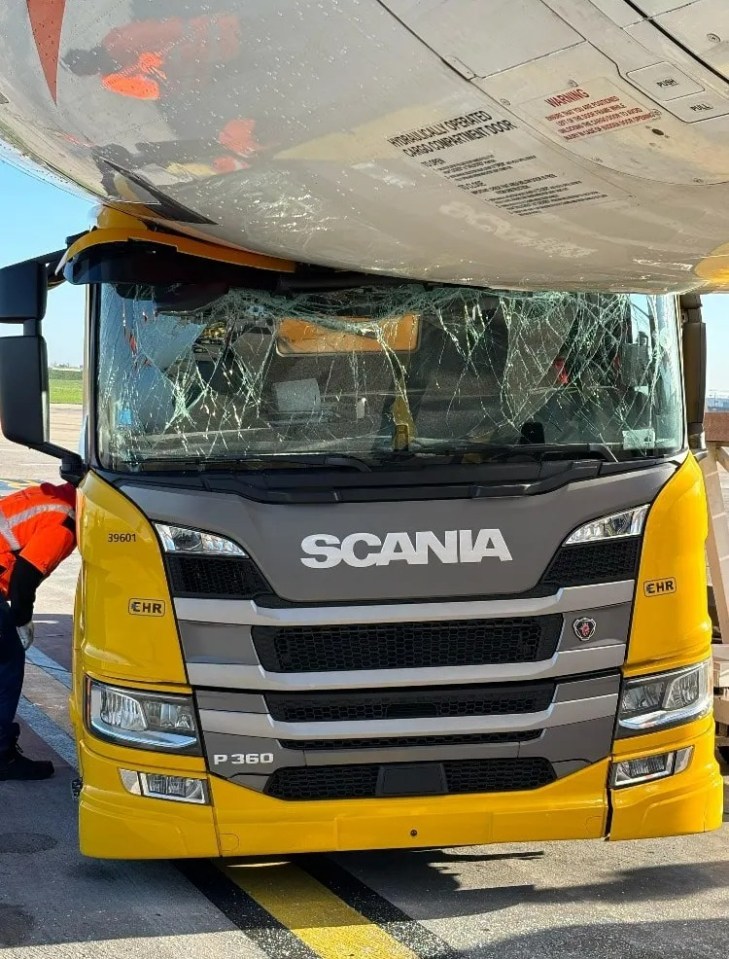 A yellow Scania truck collided with an EasyJet airplane.