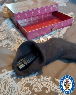 Class A drugs and a handgun were found hidden inside a jewellery box. Photo: West Midlands Police