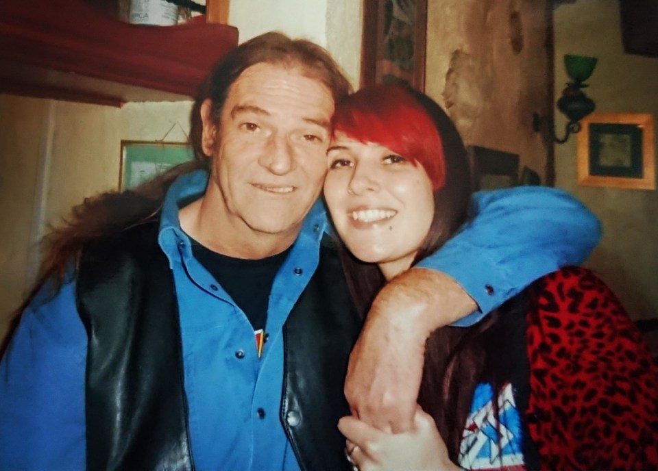 Photo of a father and daughter embracing.