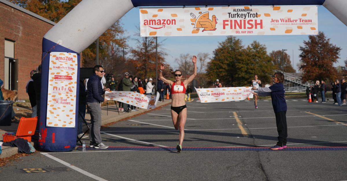 Susanna Sullivan crosses the finish line at the Turkey Trot.