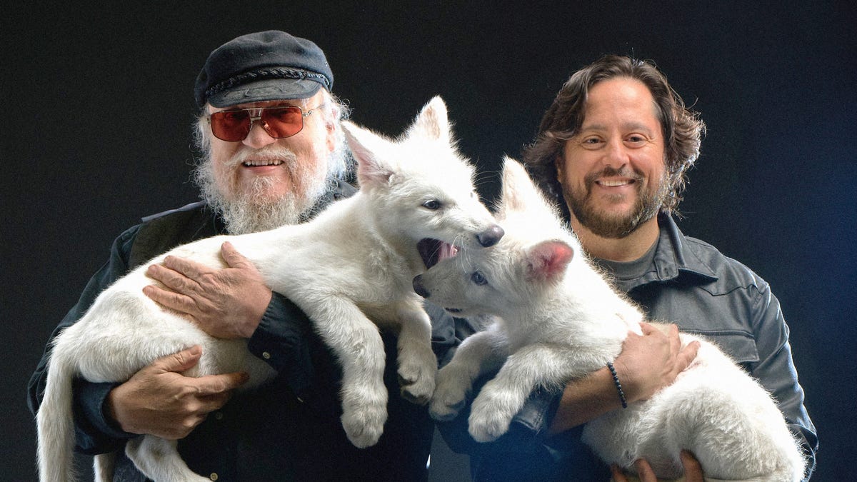 George R.R. Martin, father of fictional dire wolves, meets real ones