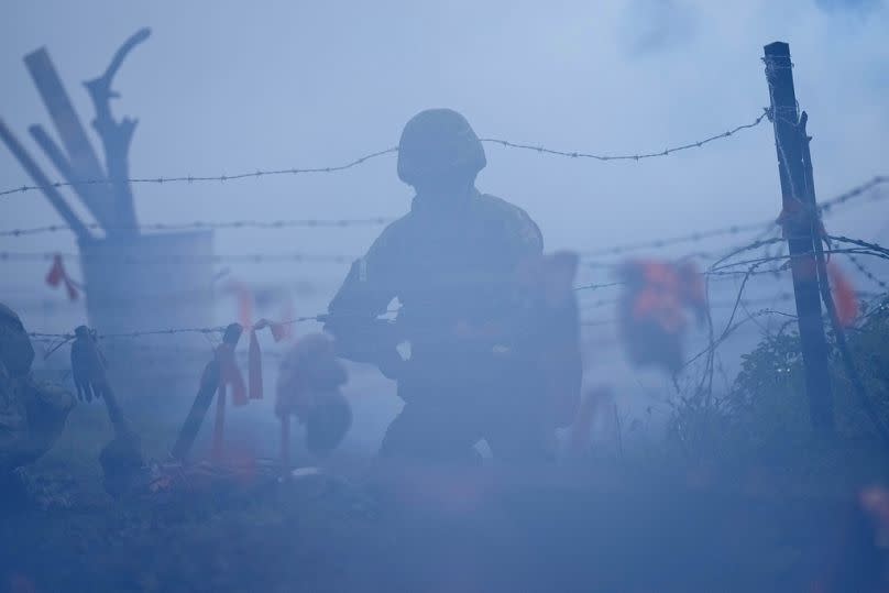 Ukrainian soldiers exercise during a visit by the Swedish Crown Princess and Prince to the STANTA training camp, England, 29 November 2023.