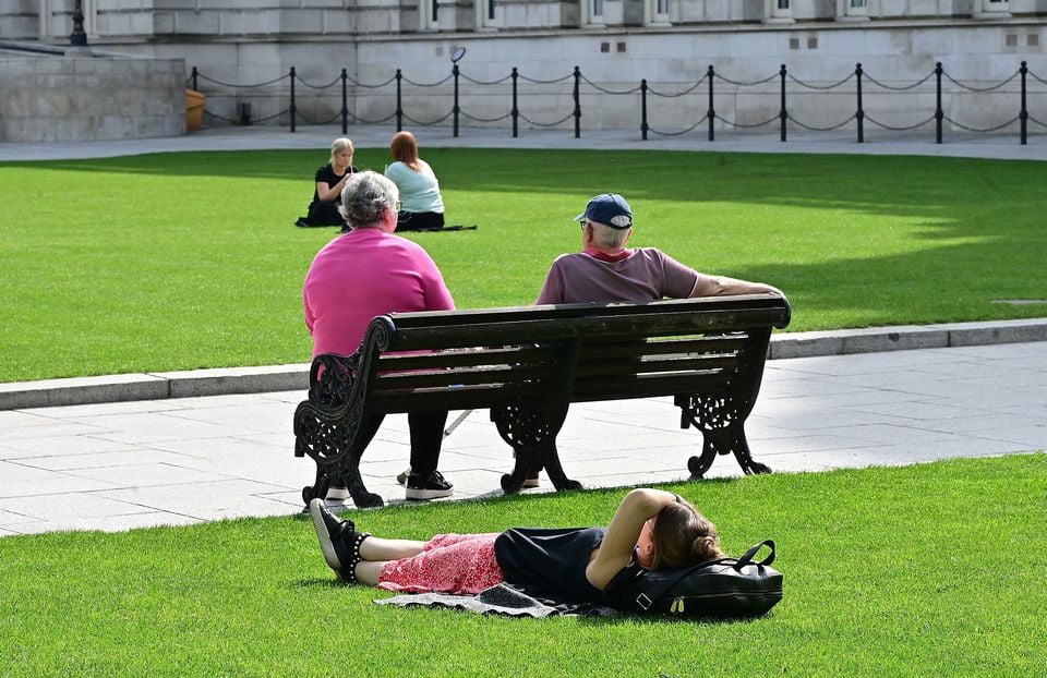 People enjoying a great sunny day at Belfast City Hall. Pic: Arthur Allison /Pacemaker Press