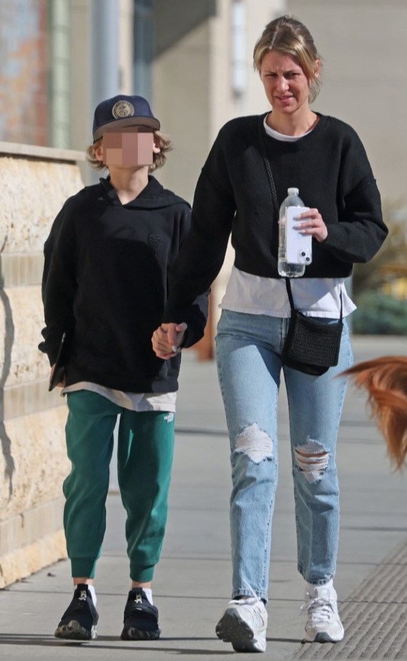Briana Jungwirth and her son Freddie walking.