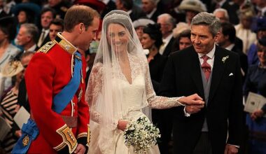 Prince William talking to his new wife Kate Middleton and father-in-law Michael Middleton on their wedding day in 2011