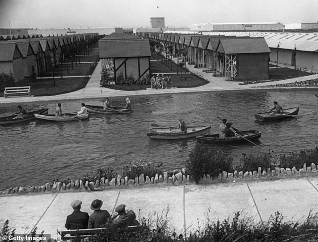 Holidaymakers are captured enjoying the Butlin's boating pond in 1939 in this image. The camp was marketed as being affordable for working people